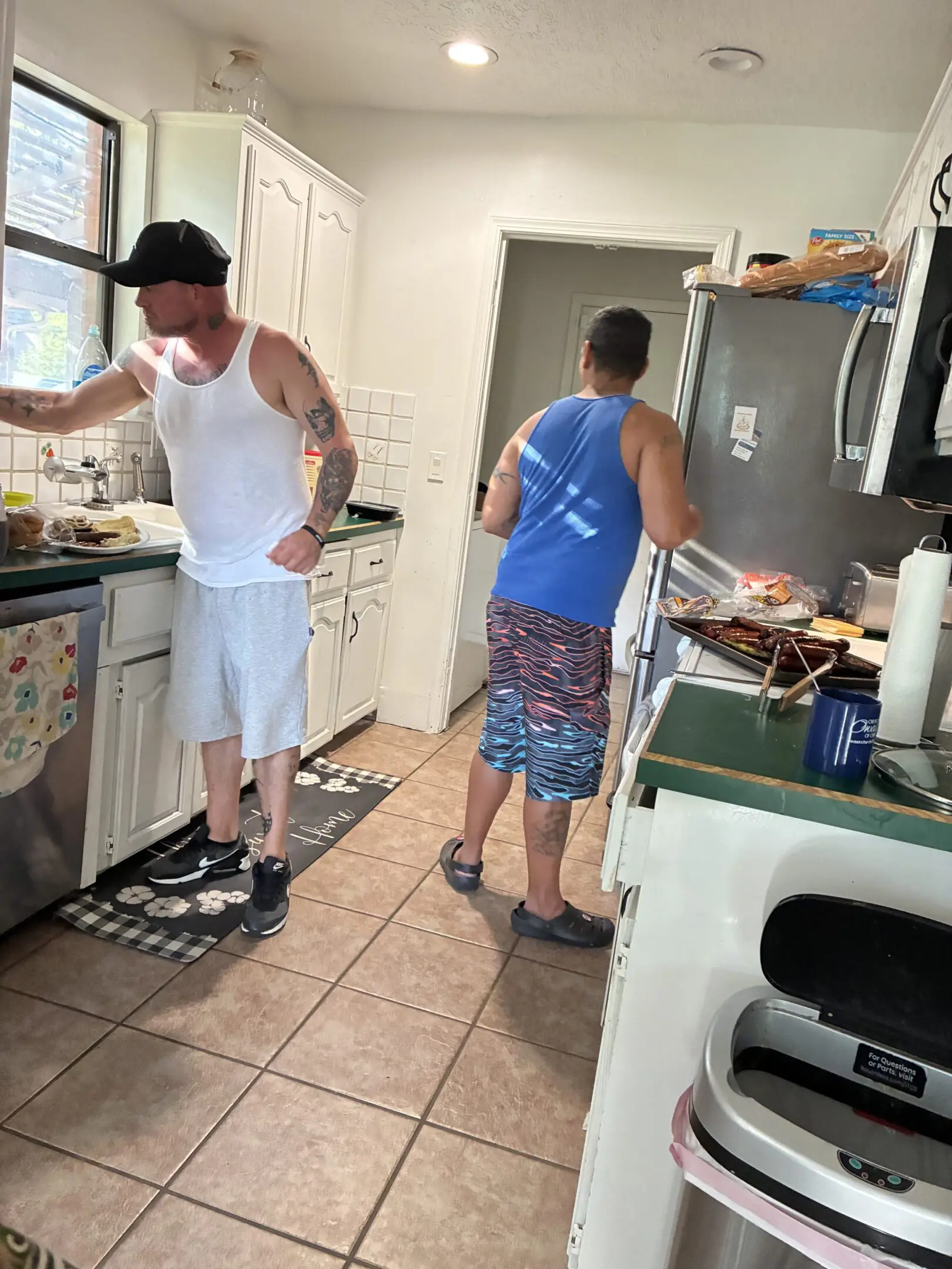 Two men cooking in a kitchen