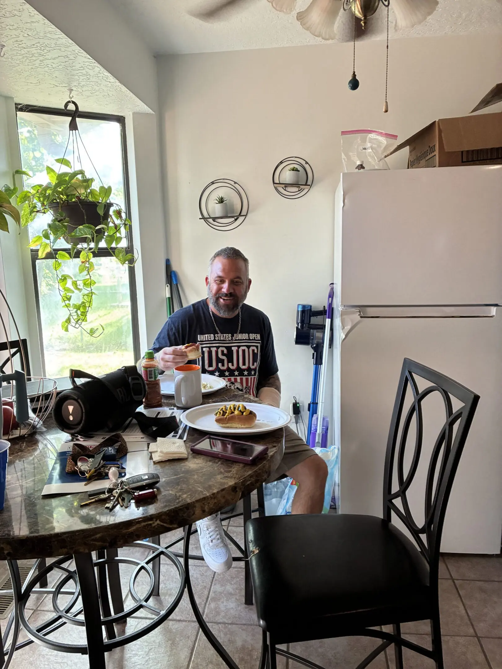 Man eating at kitchen table