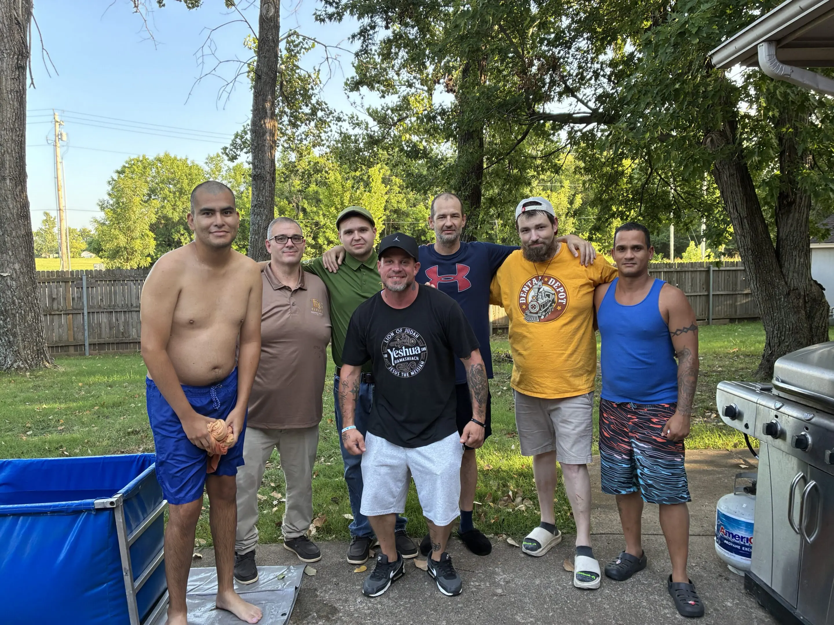 Group of men at outdoor gathering